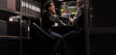 Woman police officer talking at landline phone Woman police officer talking at landline phone